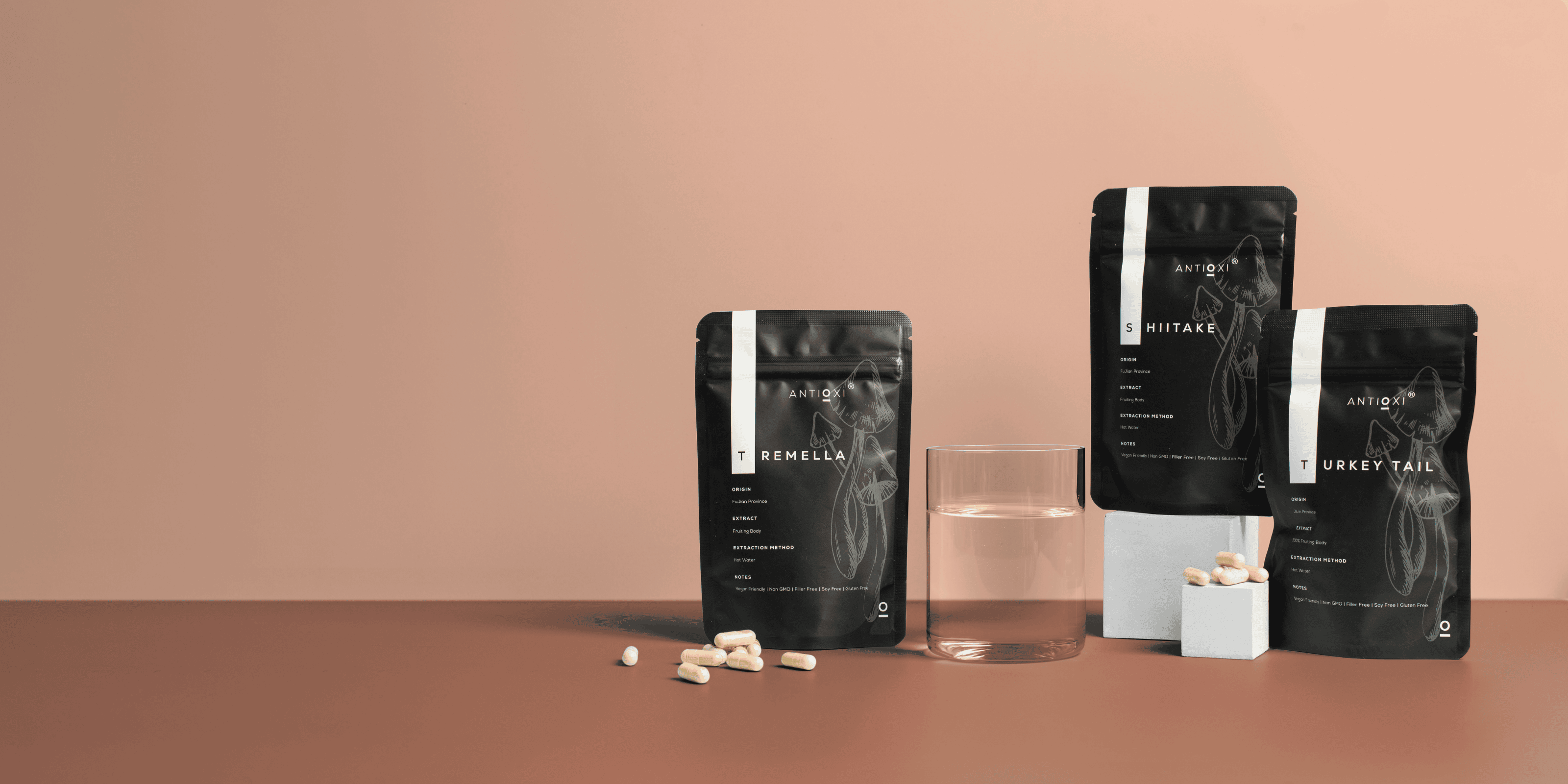 Antioxi functional mushroom supplements – Tremella, Shiitake, and Turkey Tail extracts for daily wellness with a glass of water