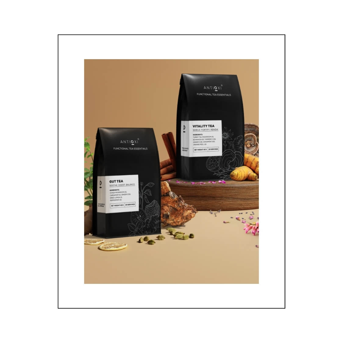 Two boxes of Antioxi functional mushroom teas, Gut Tea and Vitality Tea, are elegantly displayed against a warm, earthy backdrop with scattered natural ingredients like dried lemon slices, ginger, and turmeric.