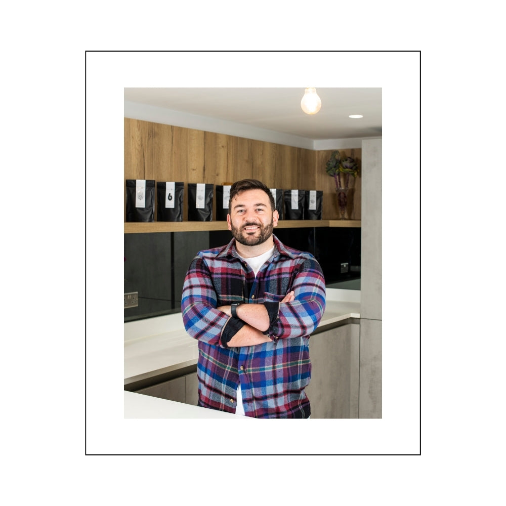 Marko Grensemann, co-founder of Antioxi, standing confidently in a product display area, exemplifying the dedication and passion behind the brand.