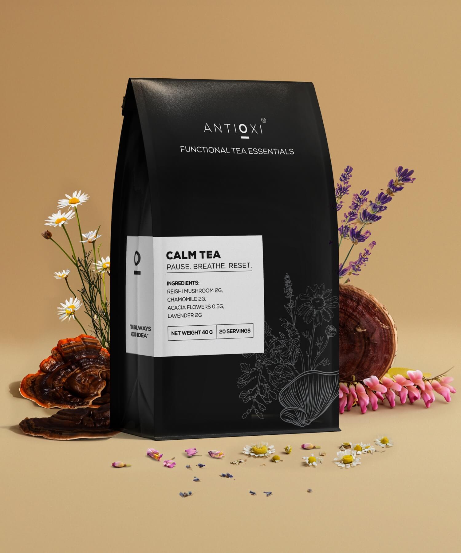 A box of Antioxi Calm functional mushroom is elegantly displayed against a warm, earthy backdrop with scattered natural ingredients like dried Reishi mushroom, Acacia flowers and Lavender.